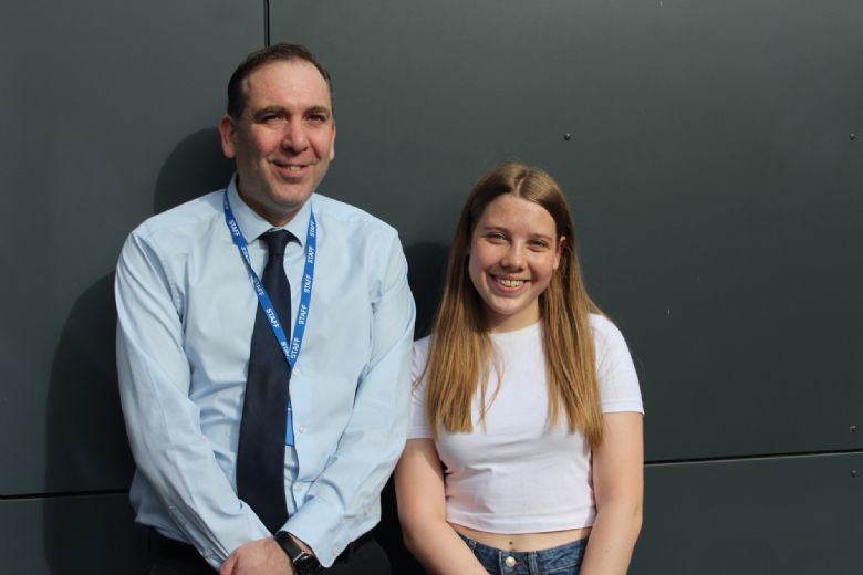 Mr Niland pictured with Poppy who achieved five grade 9s, three grade 8s and two grade 7s.