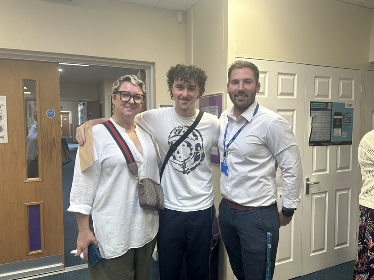Charlie (centre) pictured with his mother (left) and Mr Mills – Director of Sixth Form (right), achieved Distinction*, A*, A and is moving on to study Fashion Marketing at the University of Manchester. Charlie (centre) pictured with his mother (left) and Mr Mills – Director of Sixth Form (right), achieved Distinction*, A*, A and is moving on to study Fashion Marketing at the University of Manchester.